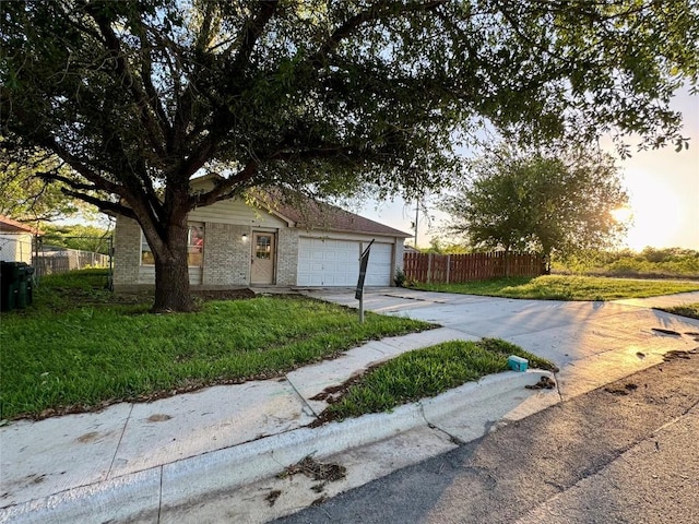 700 Lago Vista St, San Marcos, TX 78666 - single story home featuring an attached garage, concrete driveway, a front yard, and fence