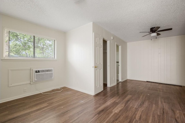 5300 Guadalupe St Unit 6202, Austin, TX 78751 - empty room featuring a wall mounted AC, wood finished floors, a textured ceiling, and ceiling fan