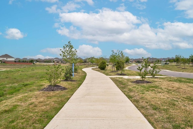 surrounding community featuring a residential view and a lawn