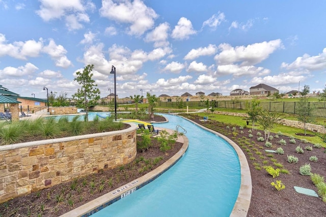 pool featuring fence