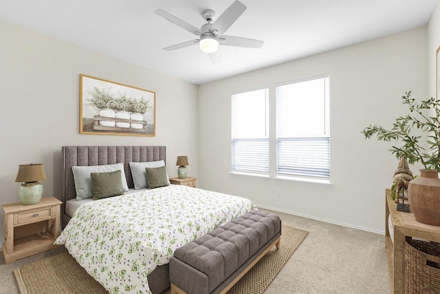 carpeted bedroom featuring ceiling fan and baseboards
