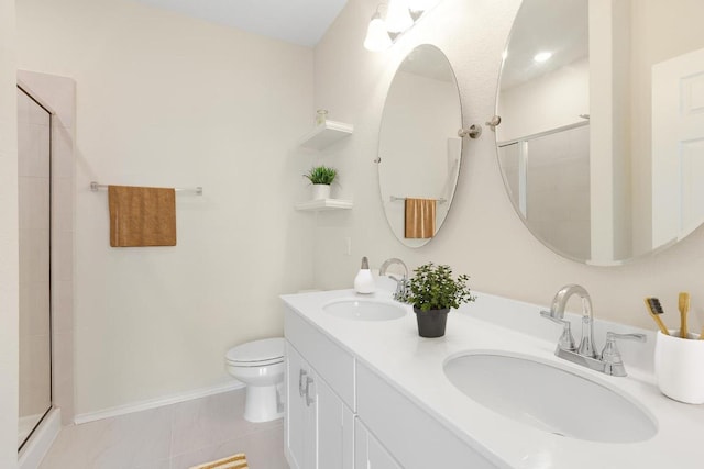 full bathroom featuring toilet, double vanity, a sink, and a stall shower