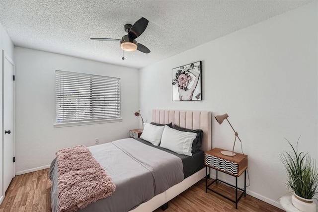 14487 Robert I Walker Blvd, Austin, TX 78728 - bedroom featuring wood finished floors, a textured ceiling, and ceiling fan