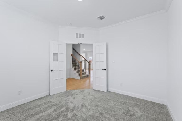 13320 Lapoynor St, Manor, TX 78653 - spare room with carpet flooring, ornamental molding, and stairway