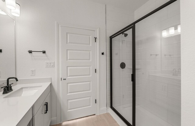 12104 Bacalar Bnd, Manor, TX 78653 - bathroom featuring vanity and a stall shower