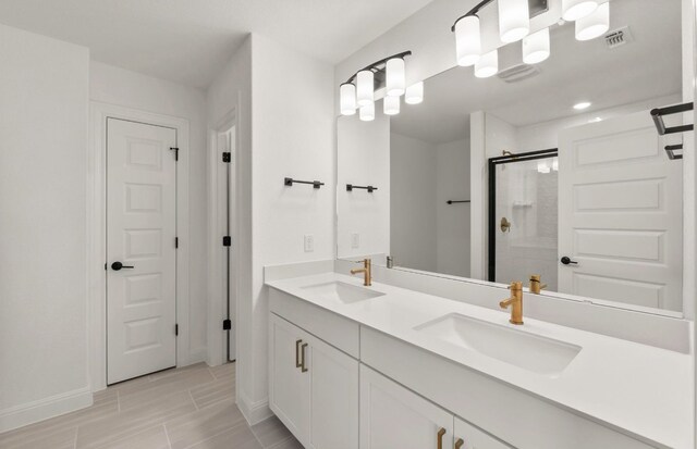16724 Santiaguillo Trce, Manor, TX 78653 - full bathroom with a shower stall and double vanity