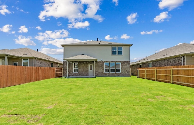 16724 Santiaguillo Trce, Manor, TX 78653 - back of house with a fenced backyard and brick siding
