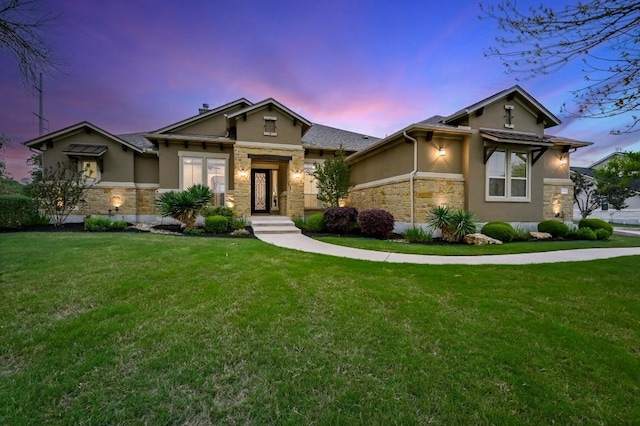 2204 High Lonesome, Leander, TX 78641 - view of front facade with stone siding, stucco siding, and a yard