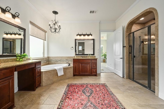 2204 High Lonesome, Leander, TX 78641 - bathroom featuring two vanities, a bath, a stall shower, crown molding, and a chandelier
