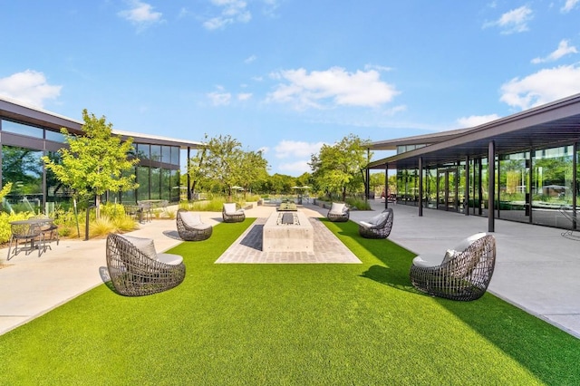 8522 Leroi Dr, Austin, TX 78744 - view of community with a patio, outdoor lounge area, and a lawn