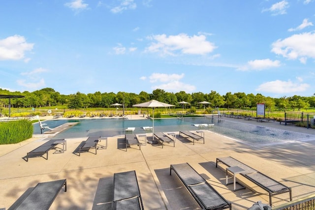8522 Leroi Dr, Austin, TX 78744 - community pool with view of wooded area and a patio area