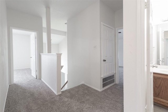 15406 Ecorio Dr, Austin, TX 78728 - corridor featuring an upstairs landing, carpet, and baseboards