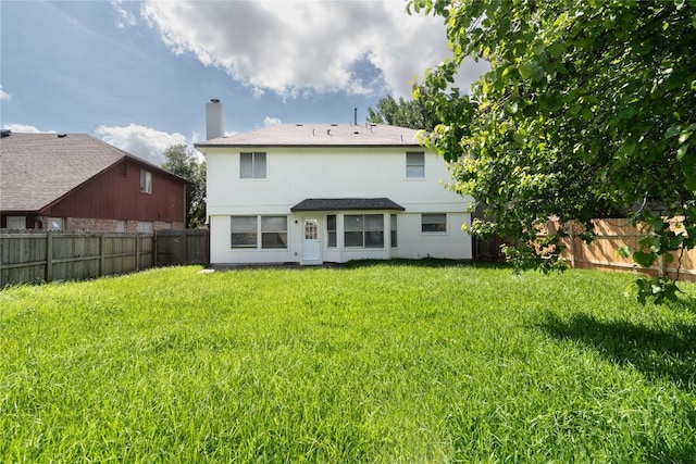 15406 Ecorio Dr, Austin, TX 78728 - back of property with a fenced backyard and a chimney