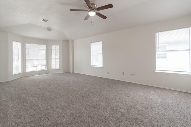 15406 Ecorio Dr, Austin, TX 78728 - spare room featuring lofted ceiling, carpet flooring, ceiling fan, and baseboards