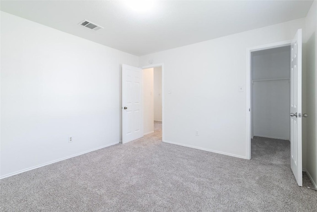 15406 Ecorio Dr, Austin, TX 78728 - unfurnished bedroom with carpet floors, a spacious closet, a closet, and baseboards