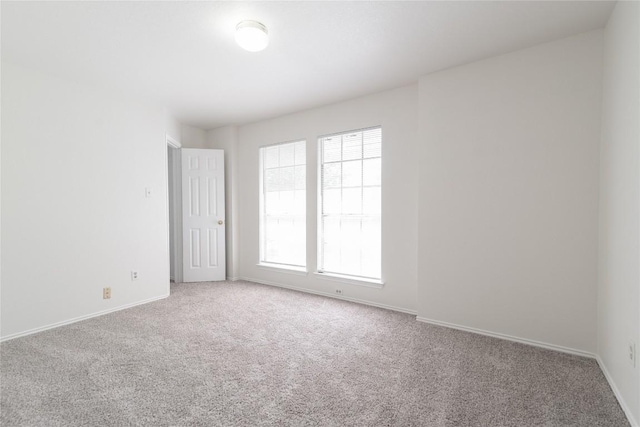 15406 Ecorio Dr, Austin, TX 78728 - carpeted empty room featuring baseboards