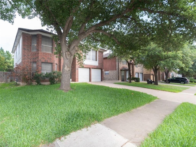 15406 Ecorio Dr, Austin, TX 78728 - view of front of property with an attached garage, driveway, and a front yard