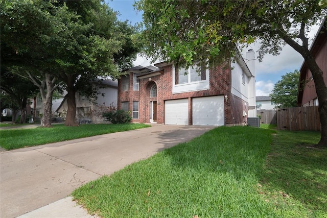 15406 Ecorio Dr, Austin, TX 78728 - view of front of house featuring brick siding, an attached garage, central AC unit, and driveway