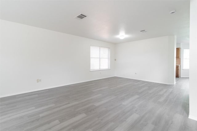 15406 Ecorio Dr, Austin, TX 78728 - spare room featuring wood finished floors, baseboards, and a smoke detector