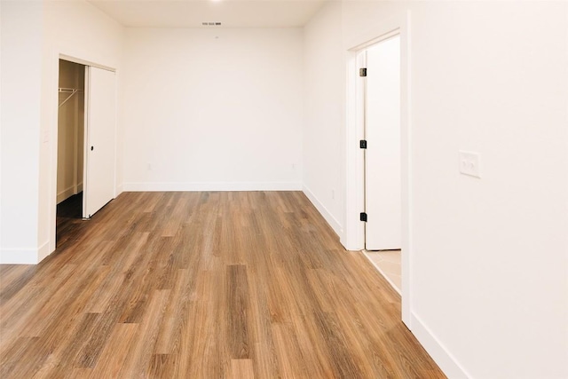 4315 S Congress Ave Unit 520, Austin, TX 78745 - unfurnished room with light wood-style flooring, baseboards, and visible vents