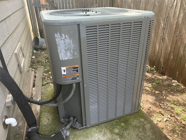 details featuring central AC and fence