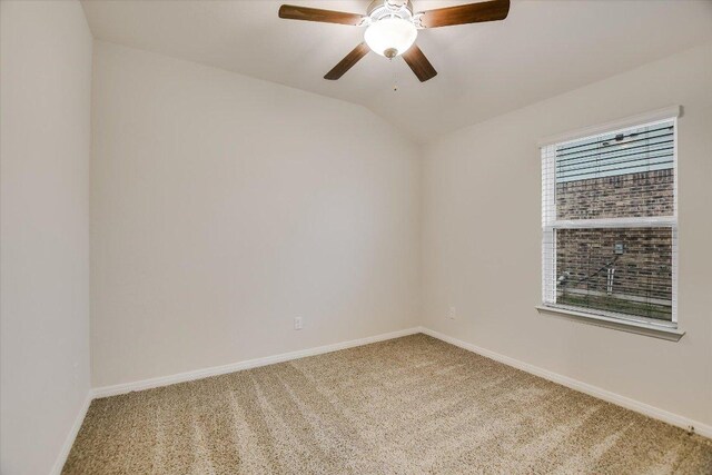 105 Saviano Rd, Hutto, TX 78634 - spare room featuring light carpet, baseboards, a ceiling fan, and vaulted ceiling