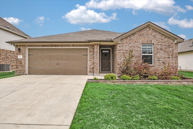 105 Saviano Rd, Hutto, TX 78634 - single story home featuring brick siding, concrete driveway, central AC unit, an attached garage, and a front lawn