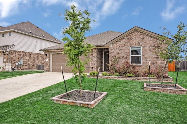 105 Saviano Rd, Hutto, TX 78634 - ranch-style home with concrete driveway, an attached garage, central air condition unit, and brick siding