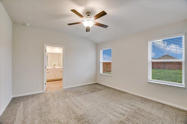105 Saviano Rd, Hutto, TX 78634 - spare room featuring carpet flooring, a ceiling fan, baseboards, and lofted ceiling