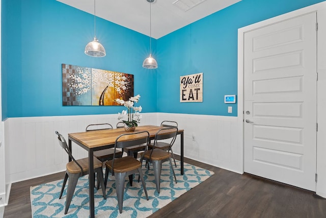 8922 Menchaca Rd Unit 204, Austin, TX 78748 - dining space with a wainscoted wall and dark wood-style floors