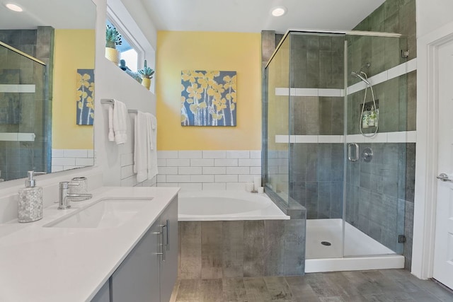 8922 Menchaca Rd Unit 204, Austin, TX 78748 - bathroom with vanity, a bath, a shower stall, and recessed lighting