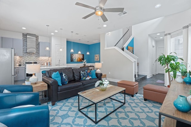 8922 Menchaca Rd Unit 204, Austin, TX 78748 - living area featuring recessed lighting, ceiling fan, stairs, wood finished floors, and baseboards