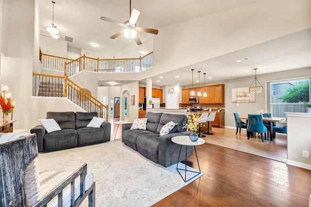 18003 Linkhill Dr, Dripping Springs, TX 78620 - living room featuring stairway, dark wood-style floors, a ceiling fan, and baseboards