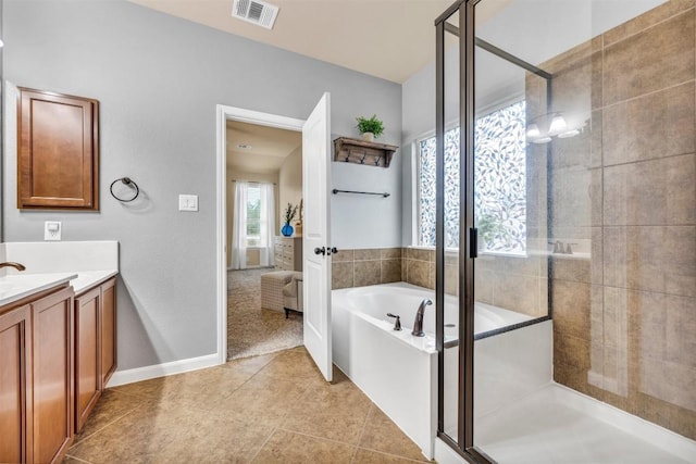18003 Linkhill Dr, Dripping Springs, TX 78620 - full bathroom with vanity, a bath, and a stall shower