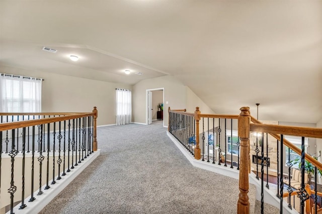18003 Linkhill Dr, Dripping Springs, TX 78620 - hall with vaulted ceiling, carpet floors, baseboards, and an upstairs landing