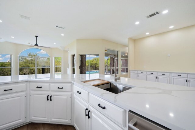 8316 Talbot Ln, Austin, TX 78746 - kitchen featuring dishwasher, a sink, white cabinetry, a ceiling fan, and recessed lighting