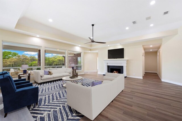 8316 Talbot Ln, Austin, TX 78746 - living room featuring a ceiling fan, recessed lighting, wood finished floors, and plenty of natural light