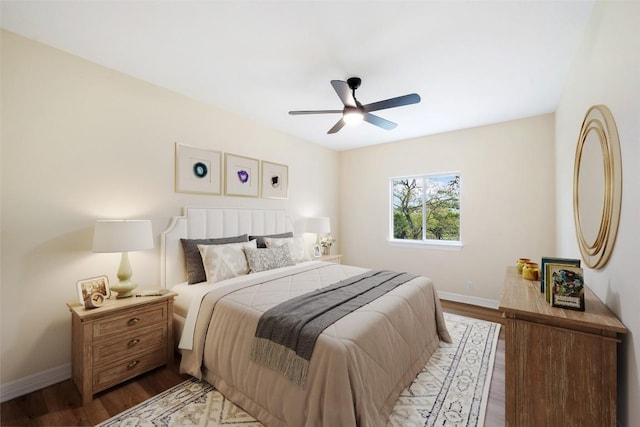 8316 Talbot Ln, Austin, TX 78746 - bedroom with baseboards, wood finished floors, and ceiling fan