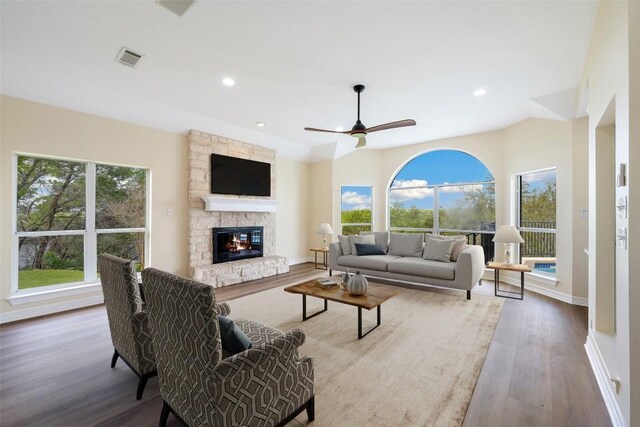8316 Talbot Ln, Austin, TX 78746 - living room with wood finished floors, a fireplace, a ceiling fan, baseboards, and recessed lighting