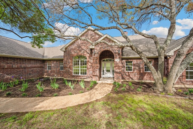 8316 Talbot Ln, Austin, TX 78746 - traditional-style house with brick siding and roof with shingles