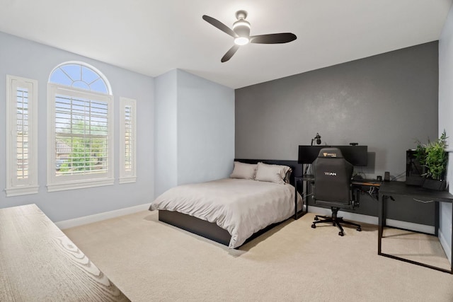 bedroom with carpet floors, baseboards, and ceiling fan