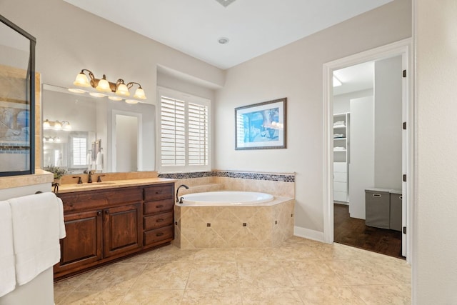 bathroom featuring a bath, vanity, tile patterned flooring, and a stall shower