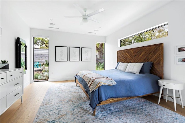 3313 Bonnie Rd, Austin, TX 78703 - bedroom with light wood finished floors, a ceiling fan, baseboards, and access to outside