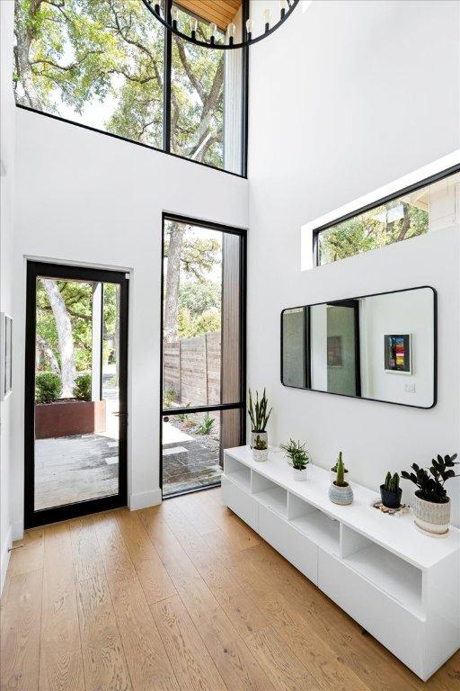 entrance foyer with a high ceiling and hardwood / wood-style flooring