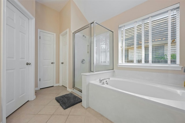 5216 Trading Bnd, Austin, TX 78735 - full bathroom featuring a stall shower, a garden tub, and tile patterned floors