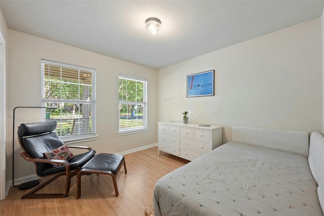 5216 Trading Bnd, Austin, TX 78735 - bedroom with light wood finished floors and baseboards