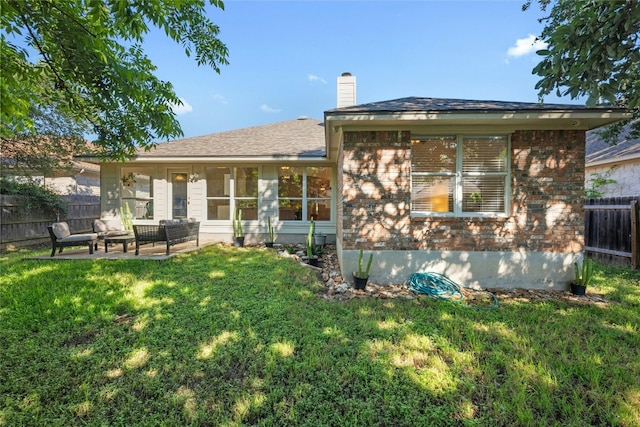 5216 Trading Bnd, Austin, TX 78735 - back of house with brick siding, a chimney, an outdoor living space, and a patio