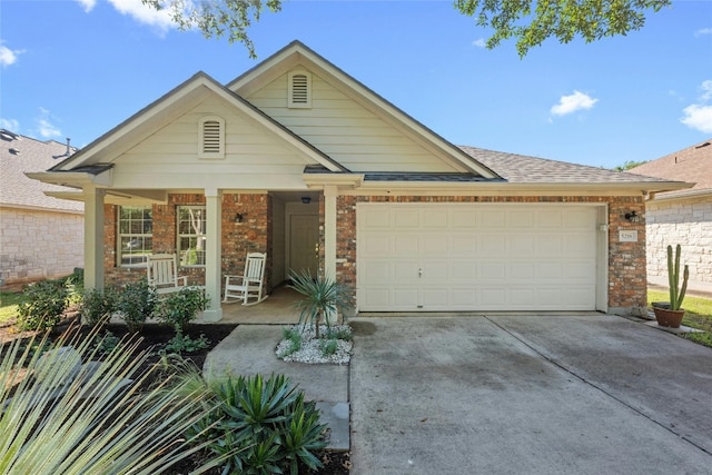 5216 Trading Bnd, Austin, TX 78735 - view of front of house featuring concrete driveway, an attached garage, covered porch, a shingled roof, and brick siding