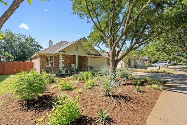 5216 Trading Bnd, Austin, TX 78735 - ranch-style home with concrete driveway, a porch, an attached garage, a chimney, and brick siding
