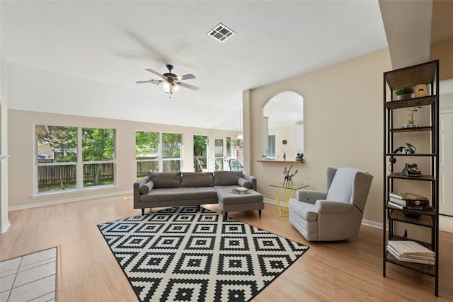 5216 Trading Bnd, Austin, TX 78735 - living room featuring a ceiling fan, wood finished floors, baseboards, and arched walkways